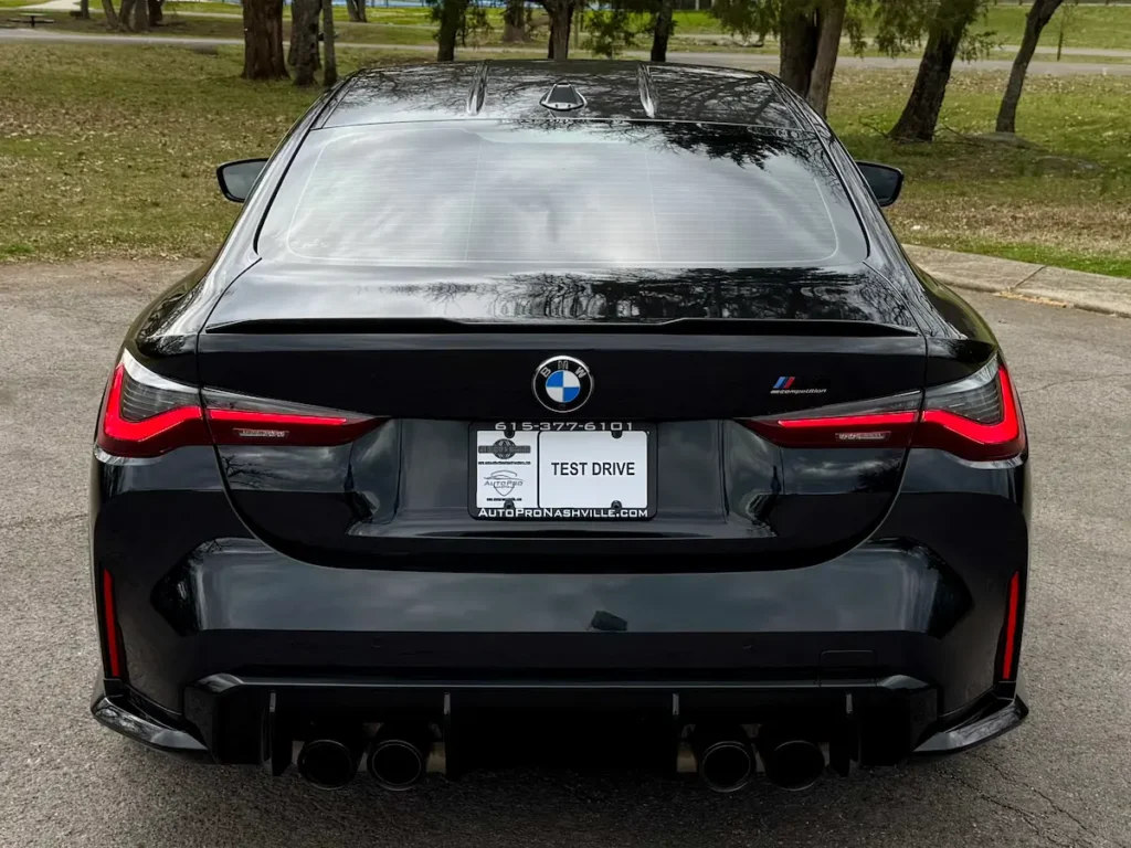 BMW M4 Competition rear exterior with quad exhaust and aggressive diffuser