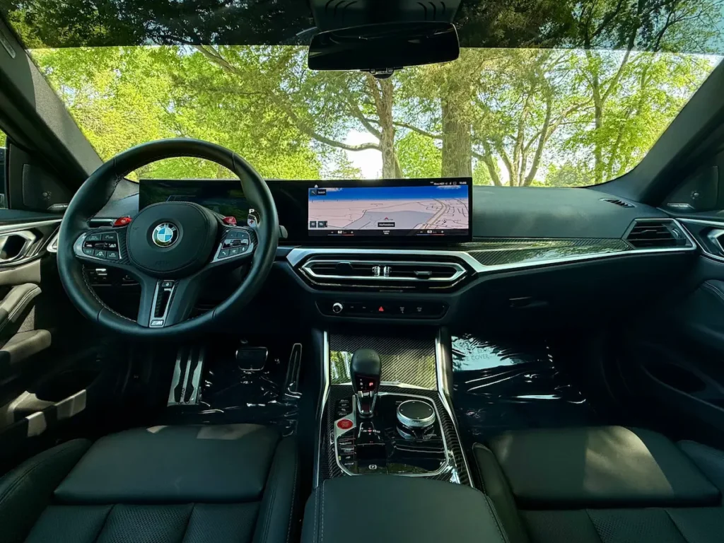 2024 BMW M4 interior with carbon fiber trim and performance cockpit