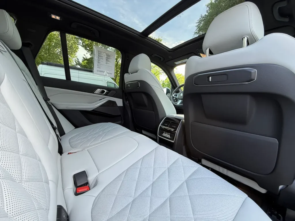 2024 BMW X5 rear seats with white leather and panoramic roof