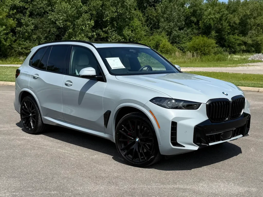 2024 BMW X5 front three-quarter view.