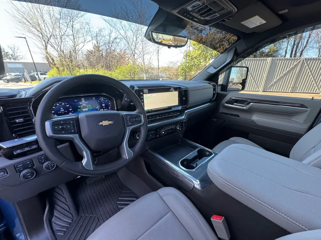 Interior view of a 2024 Silverado 2500HD LTZ with digital cluster and touchscreen.