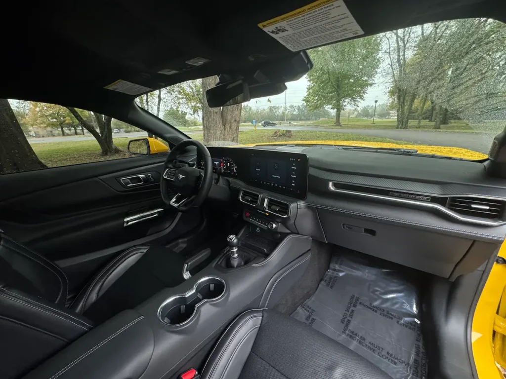 Passenger-side view of the 2024 Ford Mustang GT Premium interior with digital display.