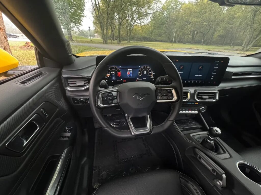 Driver cockpit of the 2024 Ford Mustang GT Premium with digital gauges.