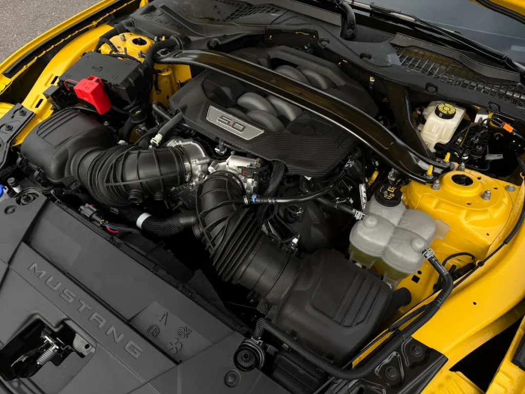 Engine bay of the 2024 Ford Mustang GT Premium showing the 5.0L Coyote V8.