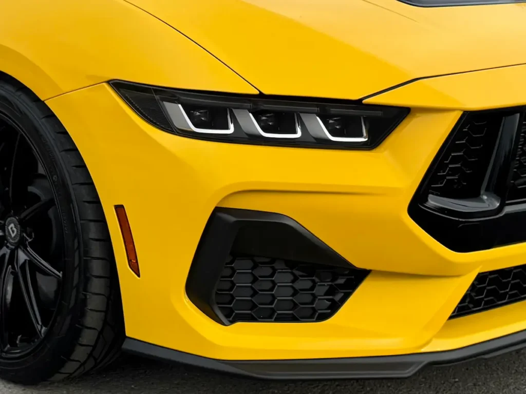 Close-up of the 2024 Mustang GT Premium front fascia and LED headlights.