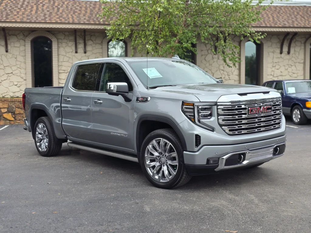 The 2024 GMC Sierra 1500 Denali Silver parked at AutoPro Nashville, highlighting its luxurious design.