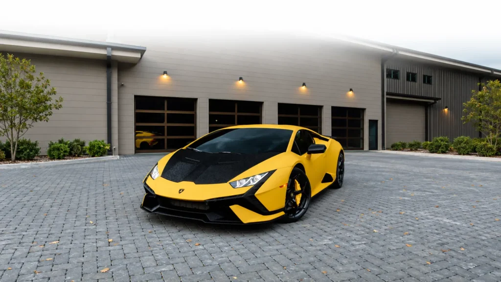 Yellow Lamborghini Huracán Tecnica shown from the front three-quarter angle