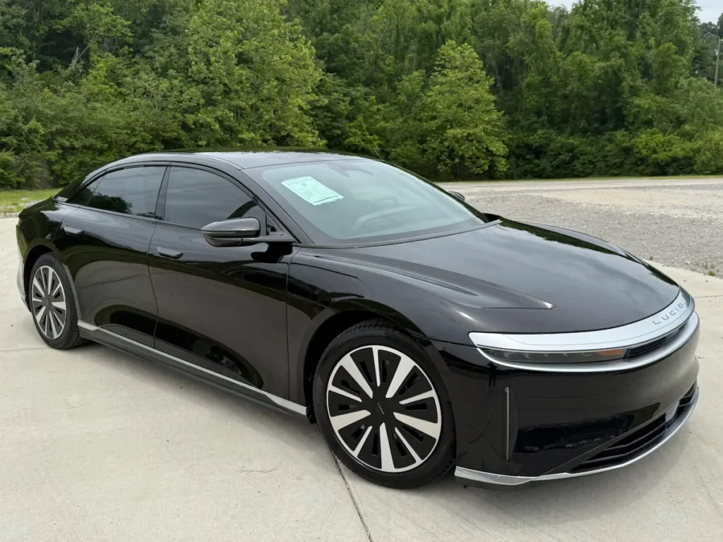Black 2024 Lucid Air luxury electric sedan shown from the front exterior angle