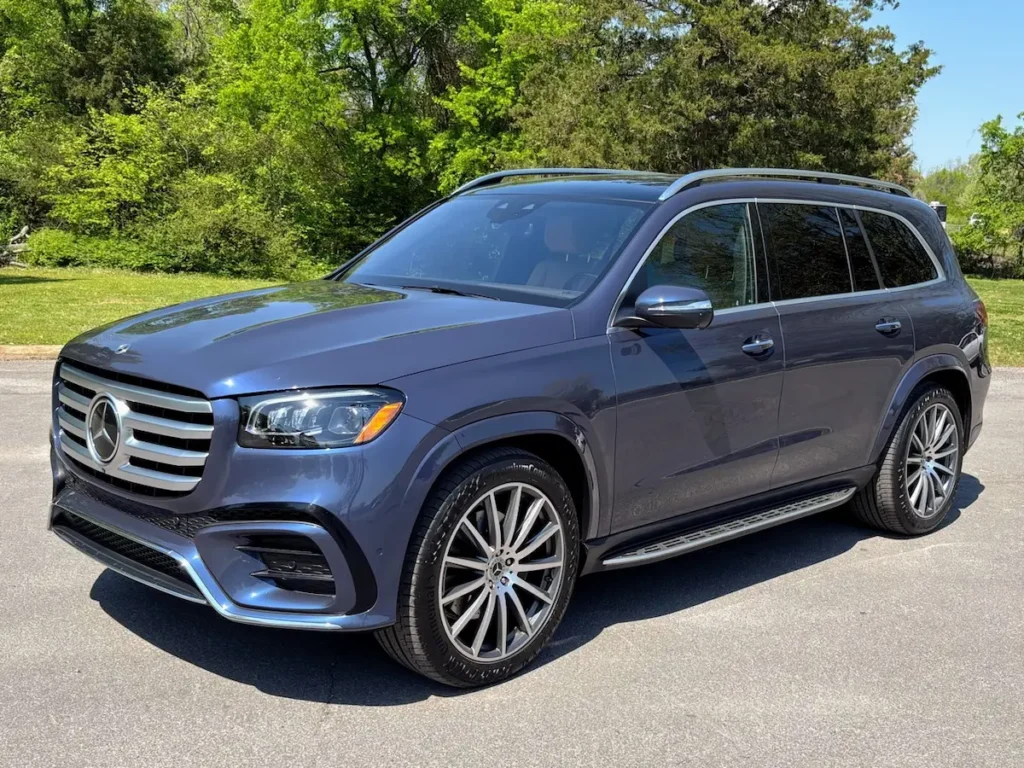 Front three-quarter view of a blue 2024 Mercedes-Benz GLS 580 4MATIC luxury SUV