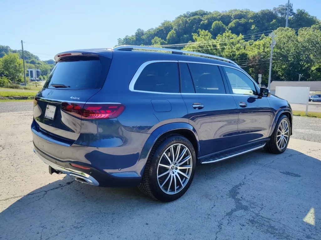Rear view of 2024 Mercedes-Benz GLS 580 blue SUV with LED taillights, chrome accents, and 4MATIC badging.