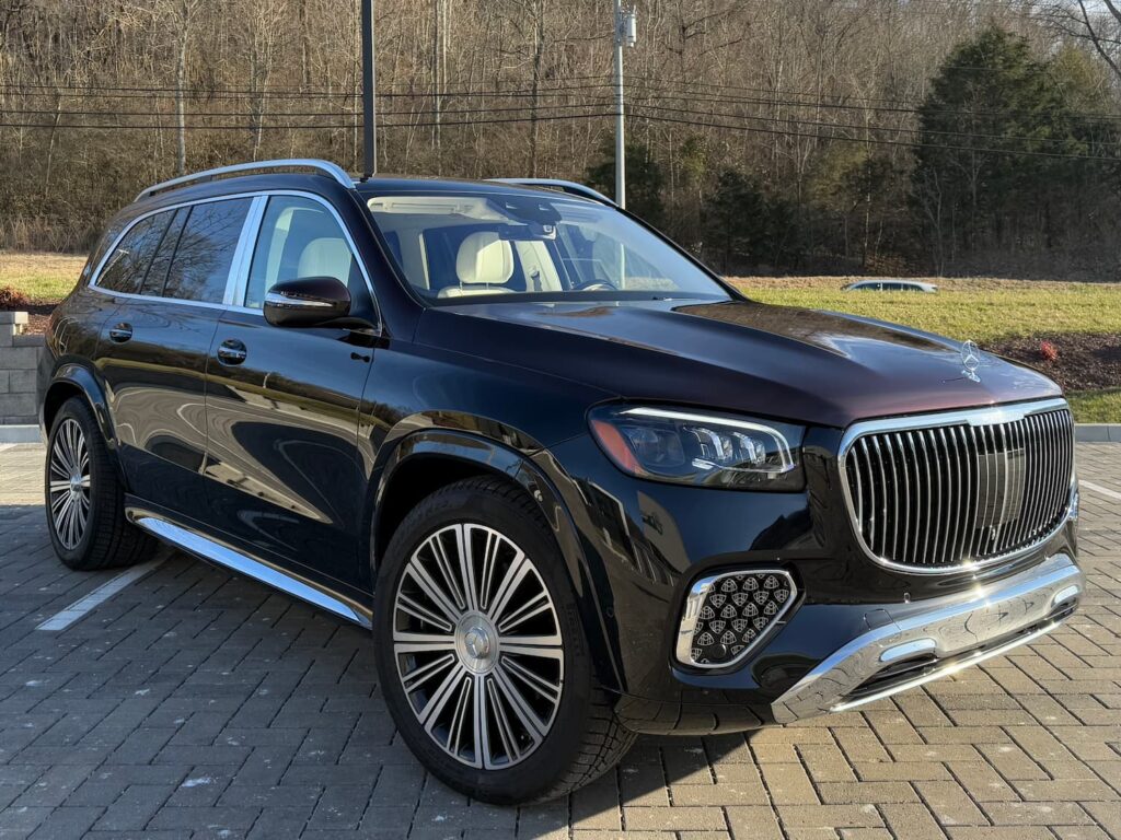 Front exterior of 2024 Mercedes-Benz GLS 600 Maybach in black with chrome grille, LED headlights, and luxury design elements.