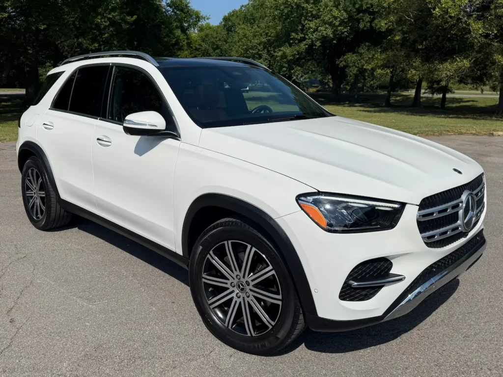 2024 Mercedes-Benz GLE 350 front view in white showing grille and LED headlights.