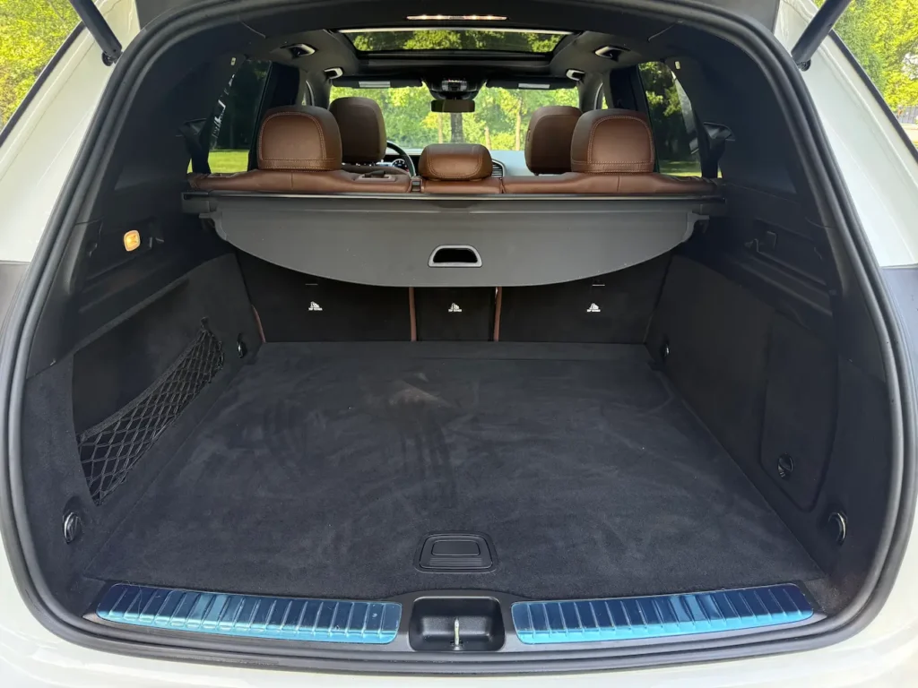 Cargo area of 2024 Mercedes-Benz GLE 350 with folded rear seats and spacious trunk.