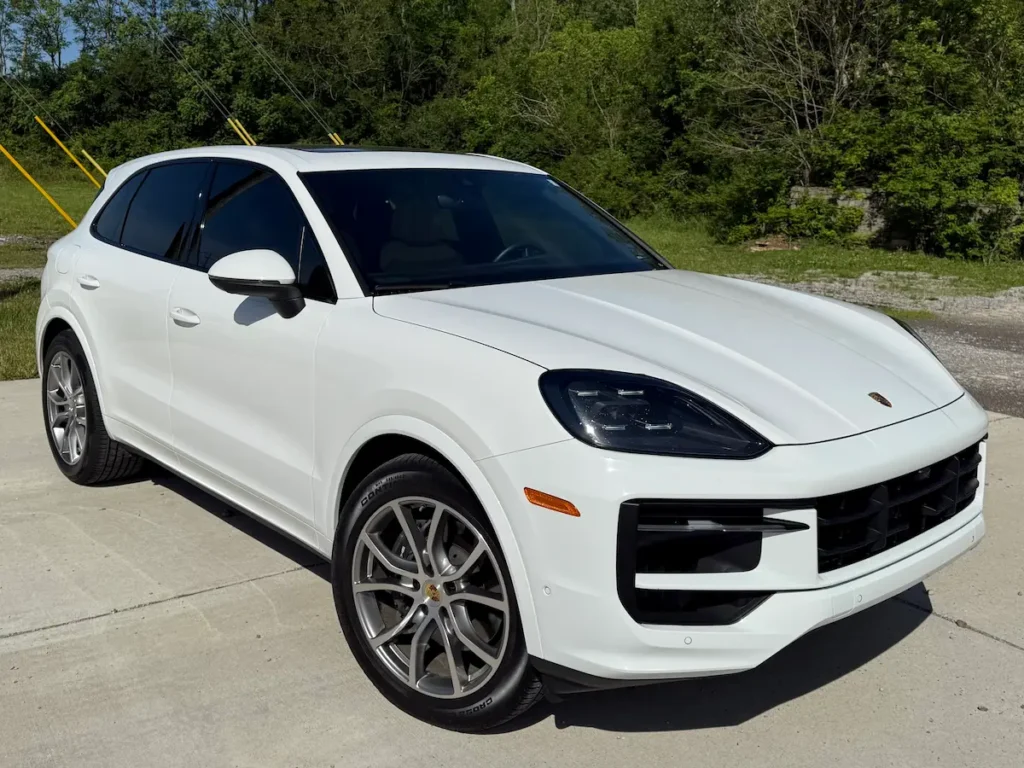 White Porsche Cayenne front view with sporty luxury SUV styling