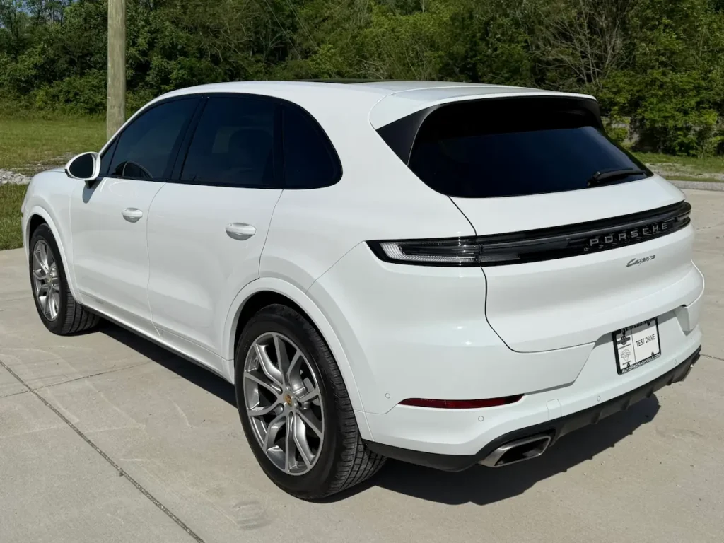 White Porsche Cayenne rear view with sleek luxury SUV design