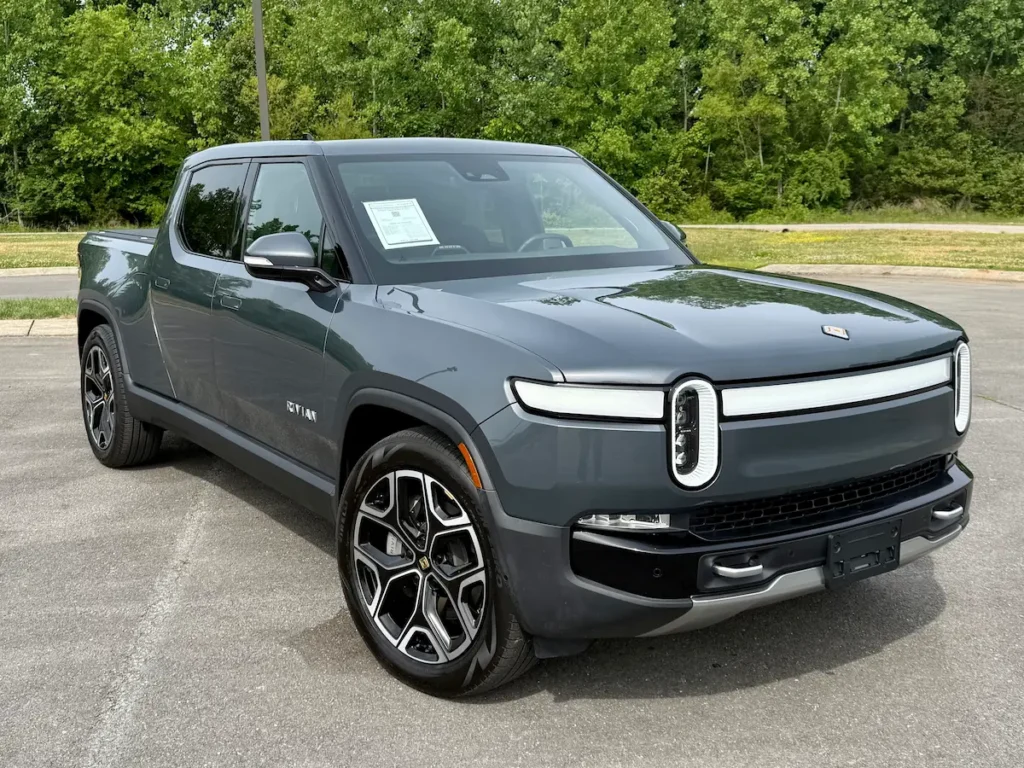 2024 gray Rivian R1T electric pickup shown from the front three-quarter angle