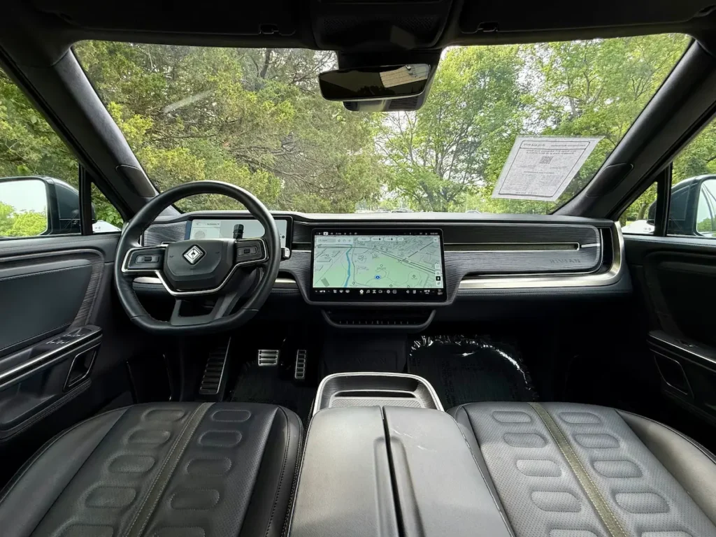 Dashboard and front cabin of a 2024 Rivian R1T with central touchscreen