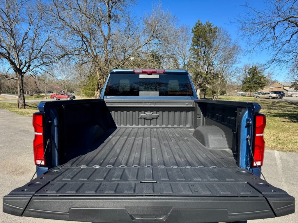 Open truck bed of the 2024 Chevrolet Silverado 2500HD LTZ with spray-on bedliner and spacious cargo area.