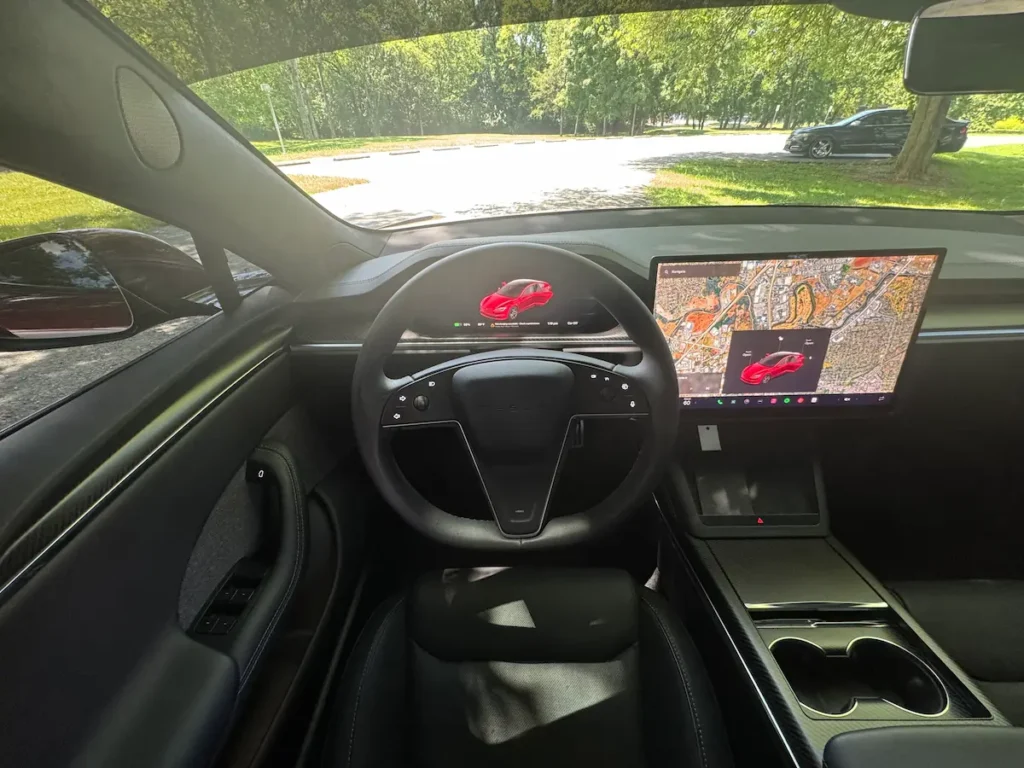 2024 Tesla Model S Plaid front interior with yoke steering and center display