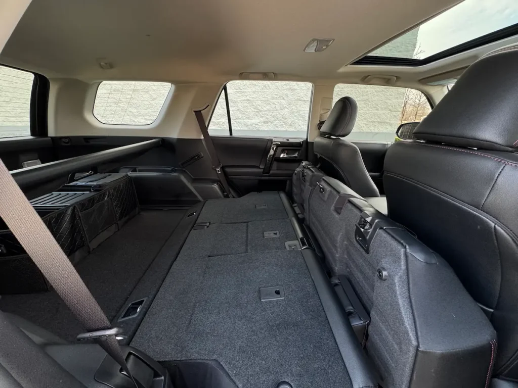 2024 Toyota 4Runner with rear seats folded to show expanded cargo space.