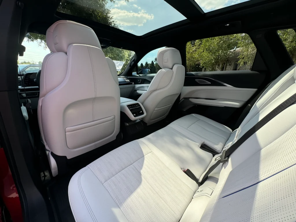 Rear seats of the 2024 Cadillac Lyriq with premium leather upholstery and ample legroom, taken at AutoPro Nashville.