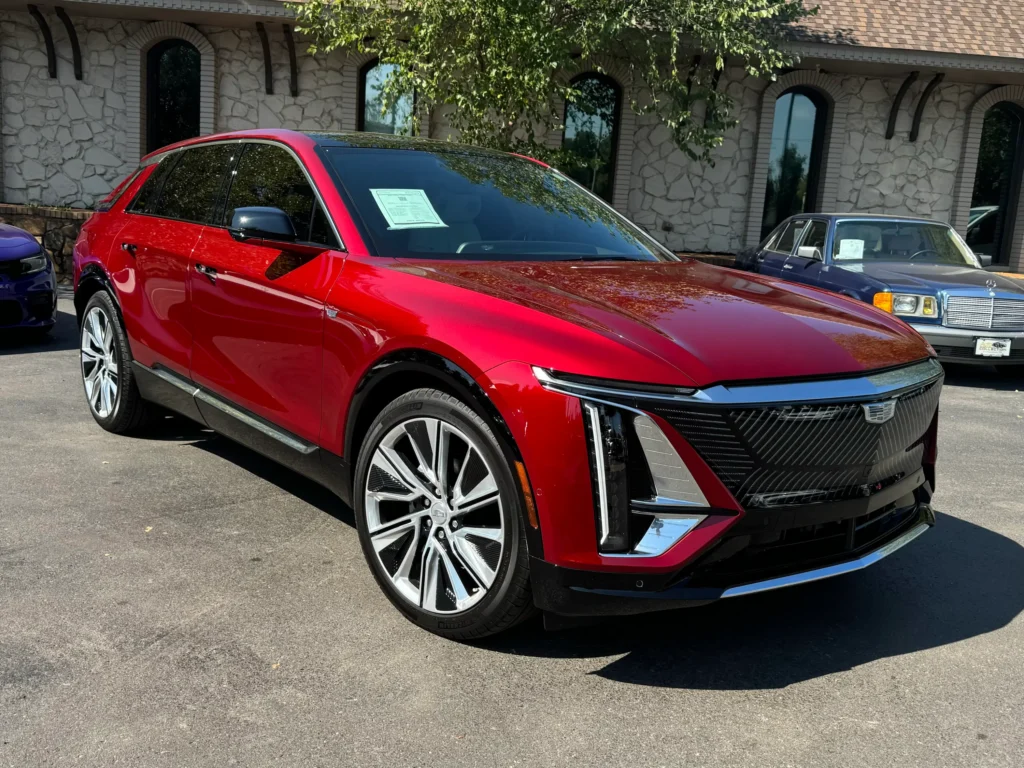 2024 Cadillac Lyriq in striking red exterior at AutoPro Nashville, front three-quarter view.