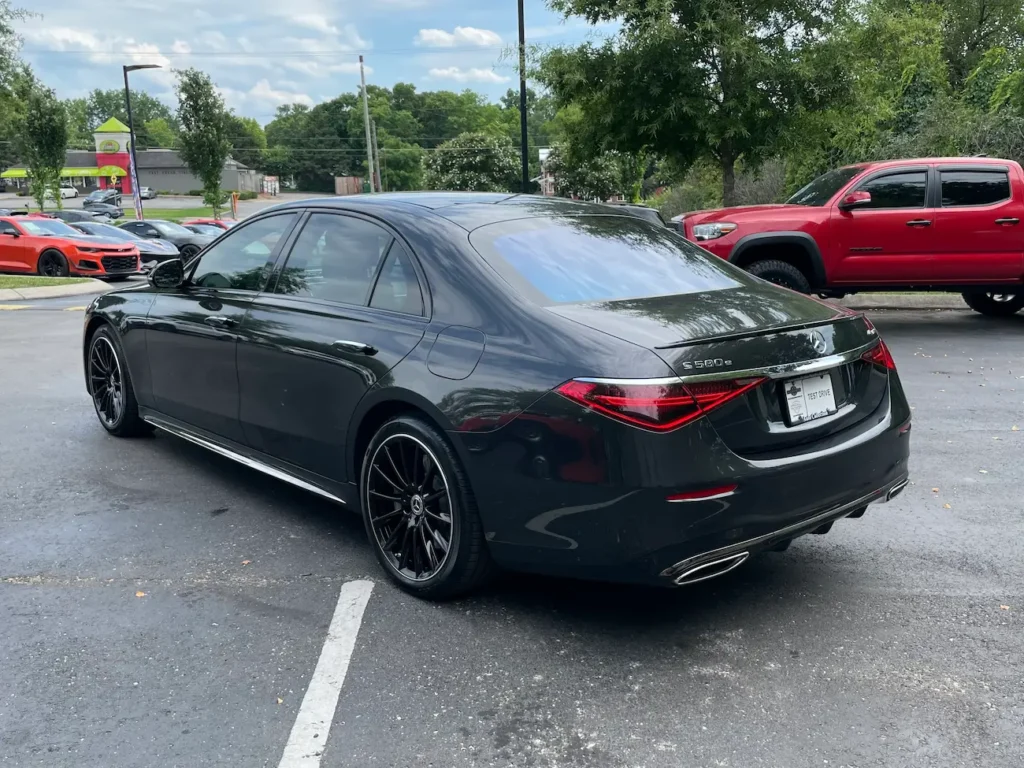 Front exterior of the 2024 Mercedes-Benz S580e highlighting LED headlights and bold grille.