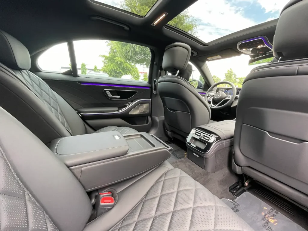 Rear exterior view of the 2024 Mercedes-Benz S580e parked outdoors.
