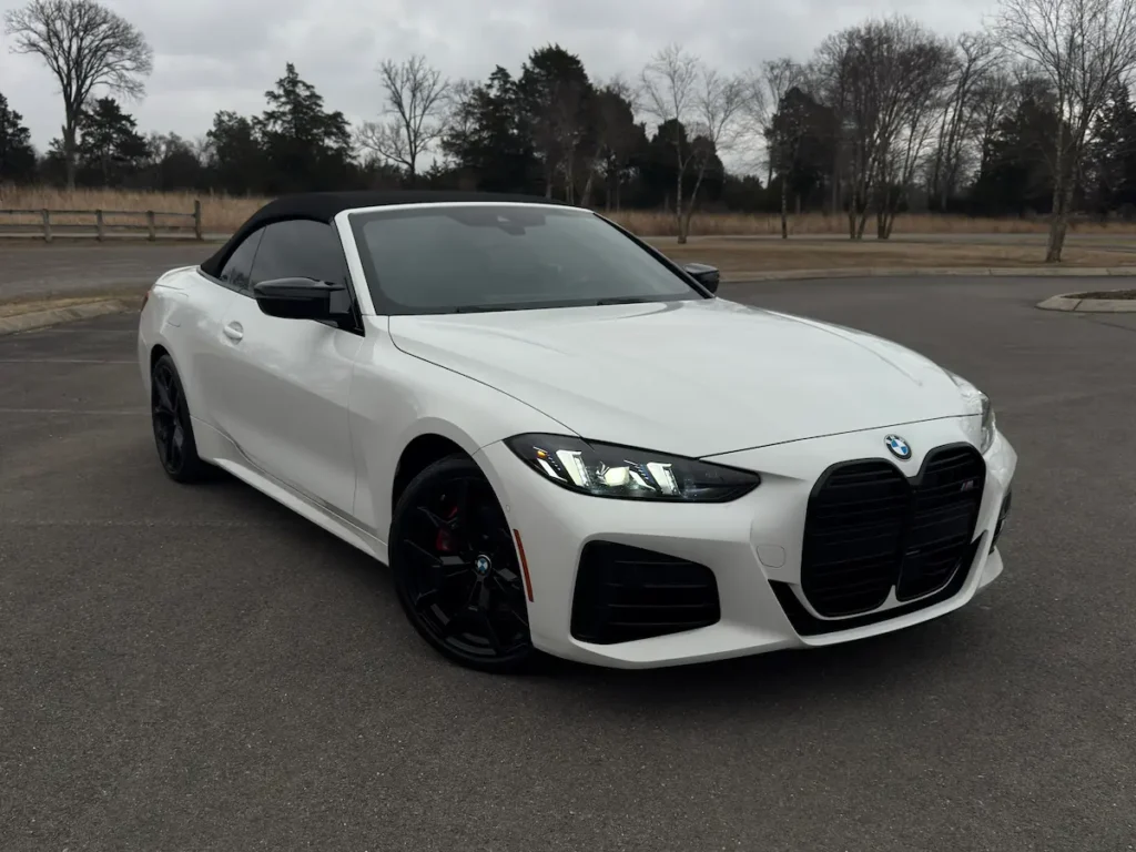 2025 BMW M440i convertible front view white exterior black wheels