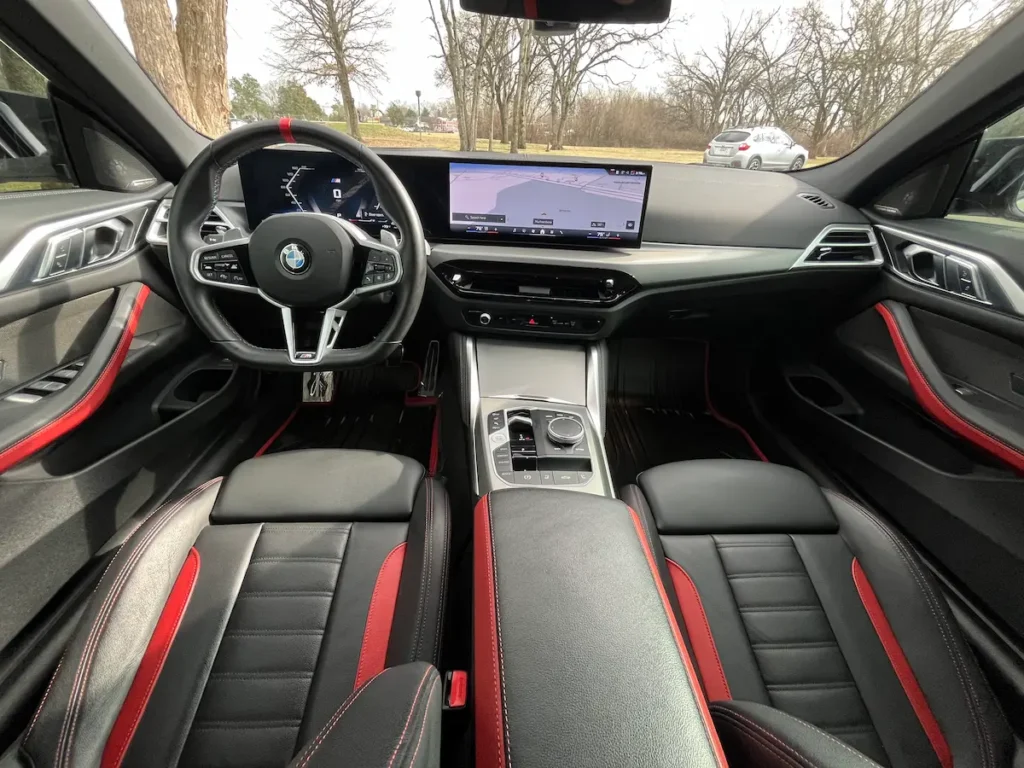 2025 BMW M440i interior with black and red sport seats