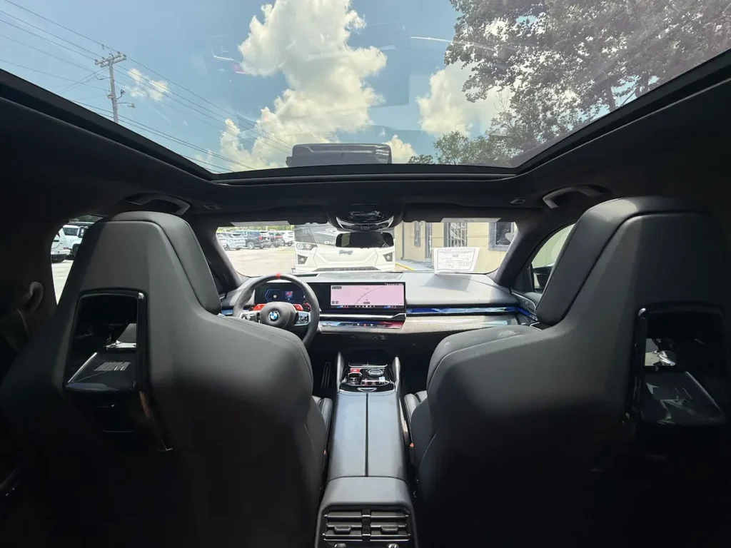 2025 BMW M5 interior with panoramic roof and performance sedan cabin