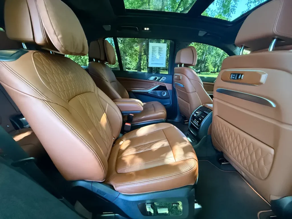 2025 BMW XB7 Alpina interior rear seating with premium leather, detailed stitching, and spacious layout.