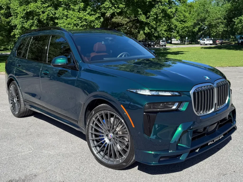 2025 BMW XB7 Alpina green exterior front angle with distinctive Alpina design elements.