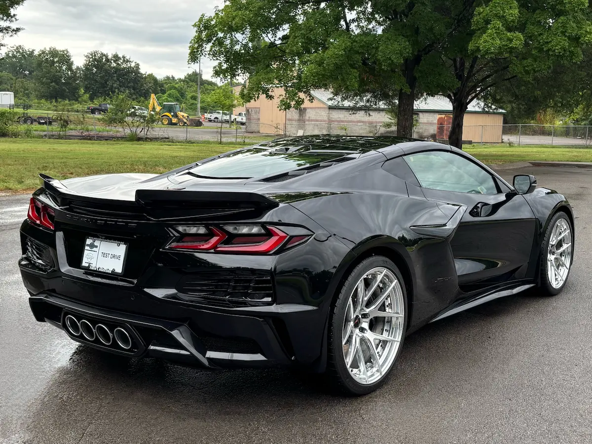 Rear three-quarter view of a black 2025 Chevrolet Corvette Z06 3LZ