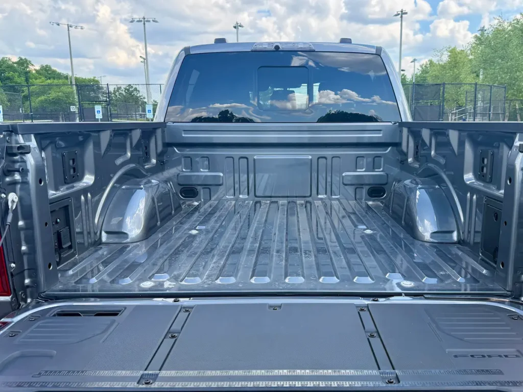 Open cargo bed of a gray 2025 Ford F-150 Raptor pickup truck
