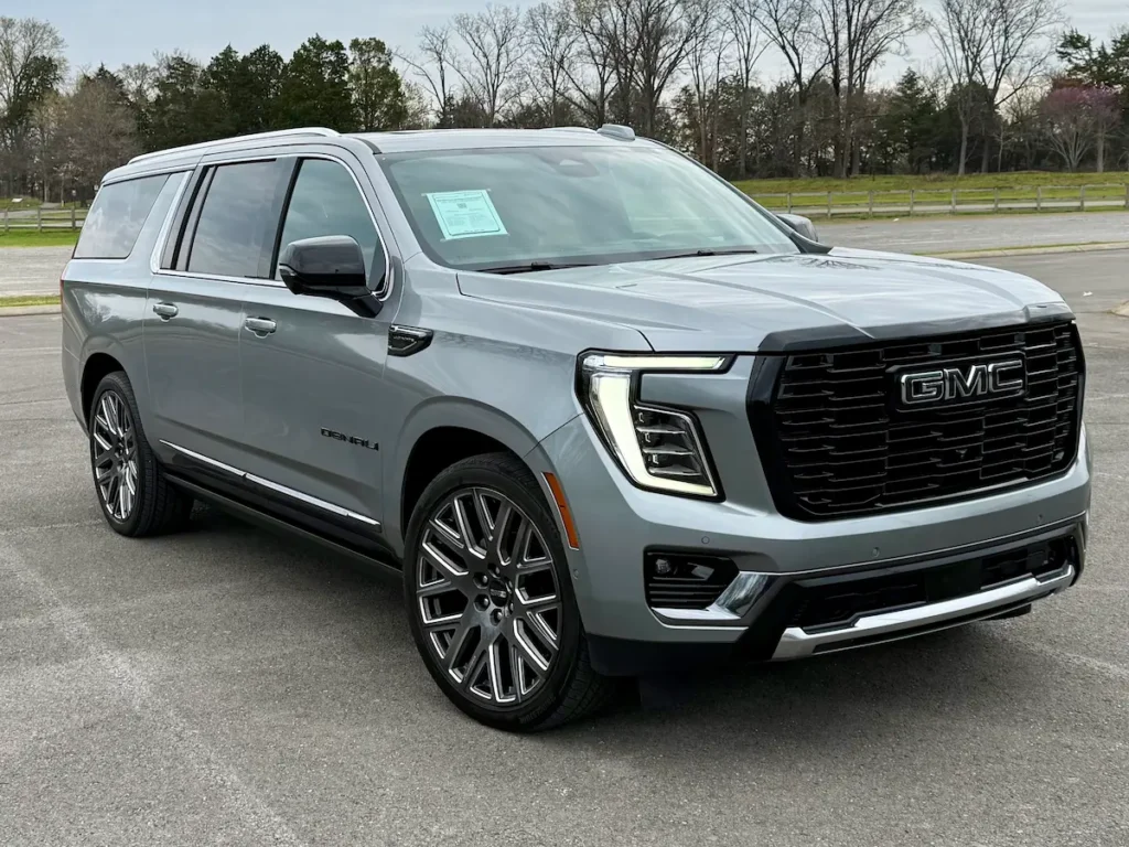 Front three-quarter view of a gray 2025 GMC Yukon XL Denali Ultimate