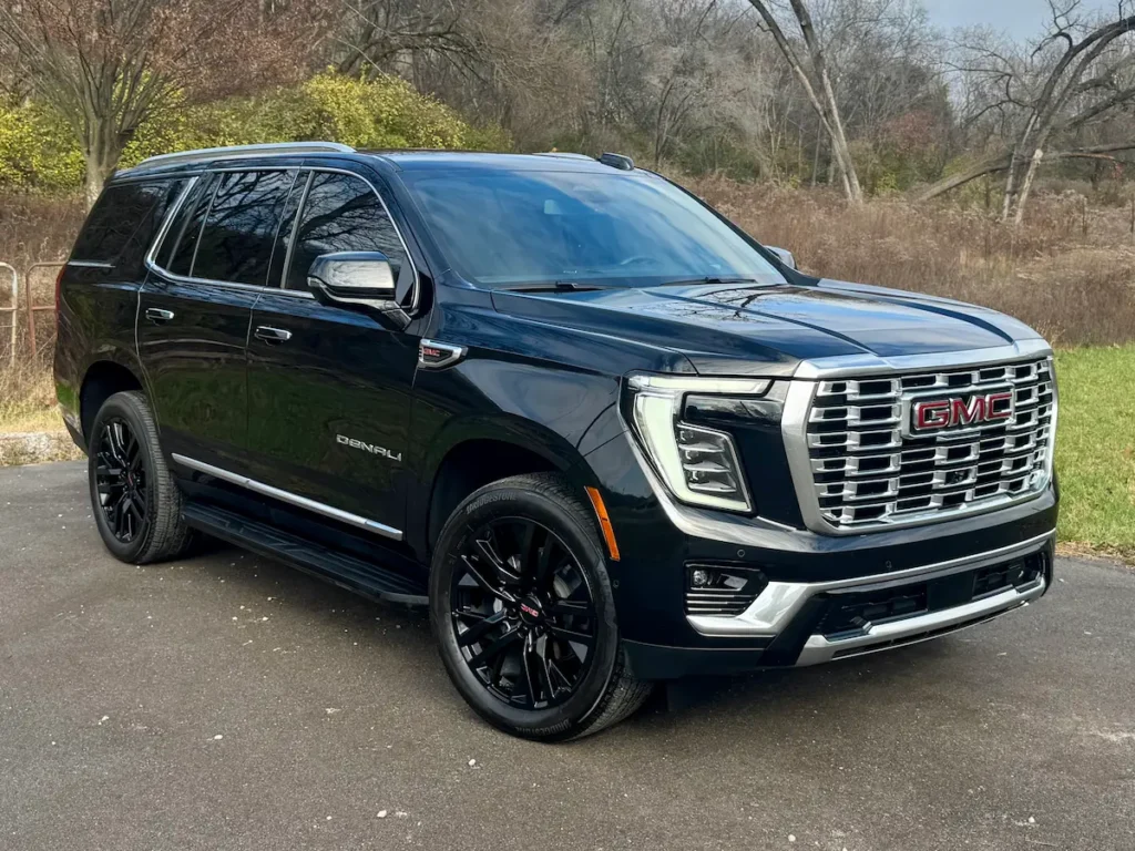 Front exterior of a black 2025 GMC Yukon Denali with chrome grille at AutoPro Nashville.