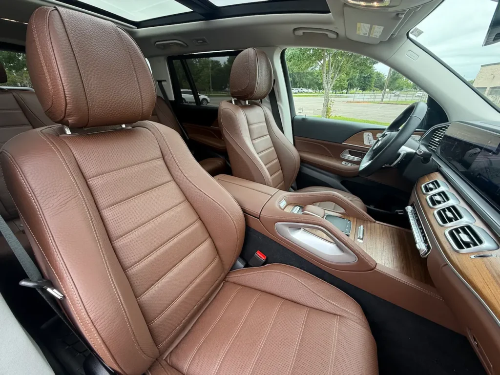 Close-up of 2025 Mercedes-Benz GLS 450 front seats in premium brown leather with stitching detail.