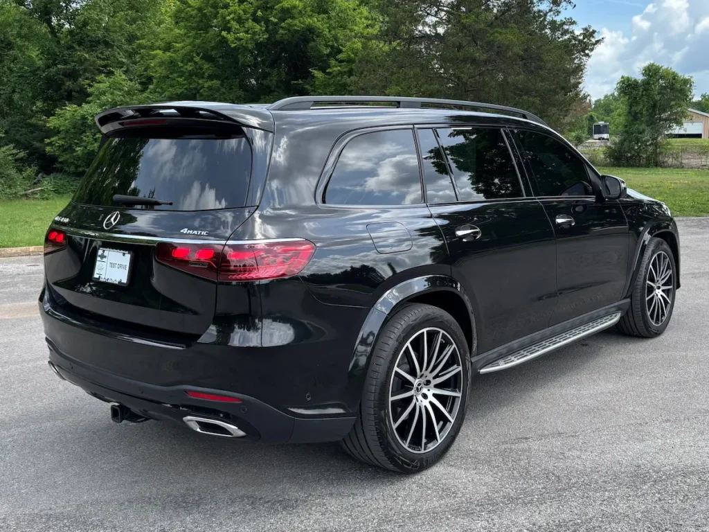 Rear three-quarter view of a black 2025 Mercedes-Benz GLS 450 4MATIC luxury SUV