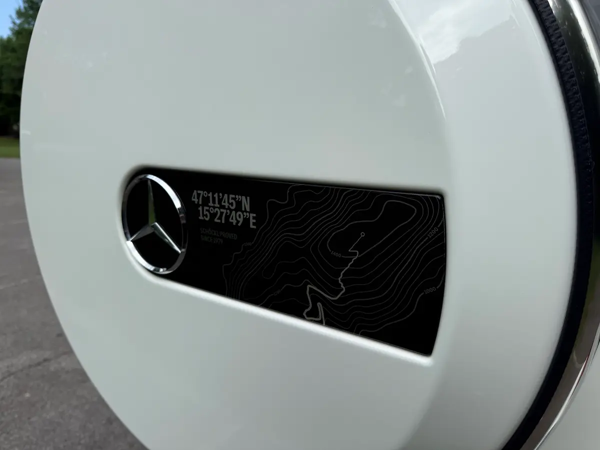 2025 Mercedes-Benz G550 rear spare tire cover with topographic coordinate design