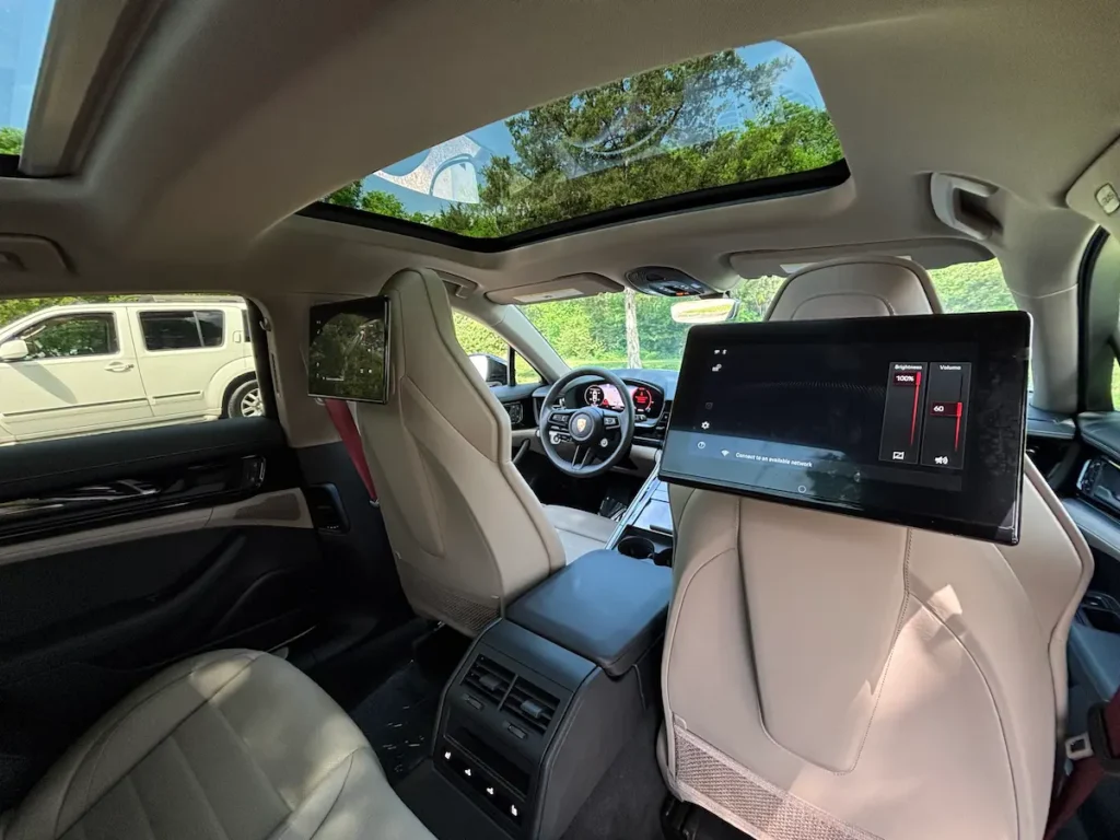 2025 Porsche Panamera rear seats with screen and luxury passenger space
