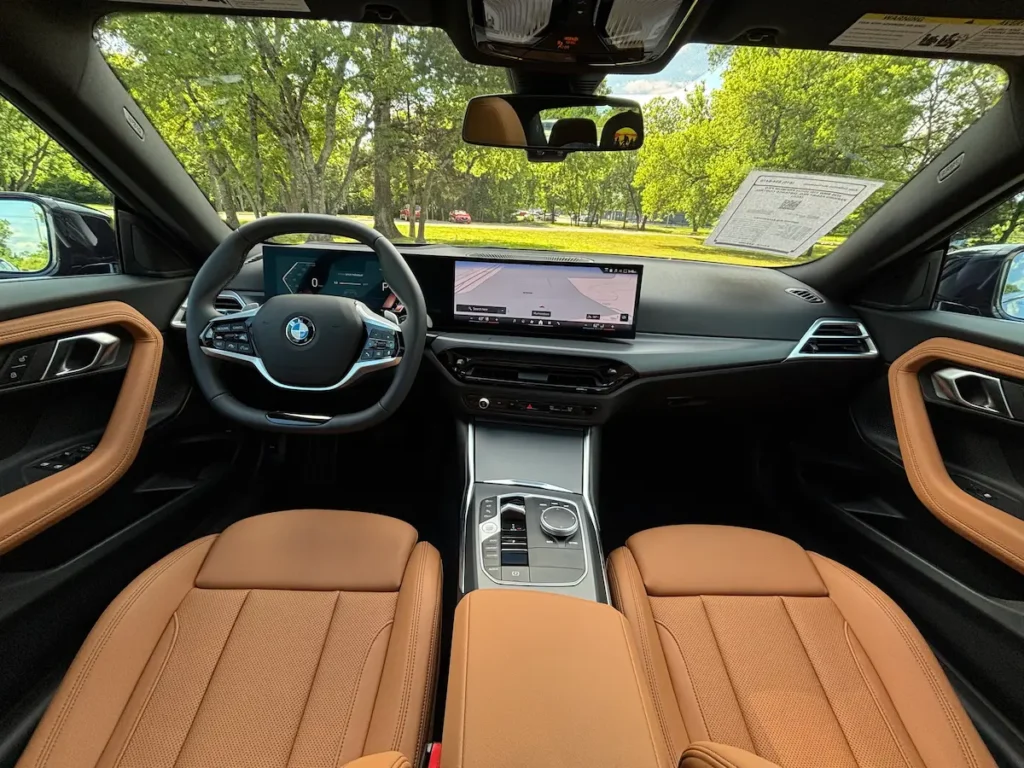 2026 BMW 230i interior with tan leather seats and digital dashboard