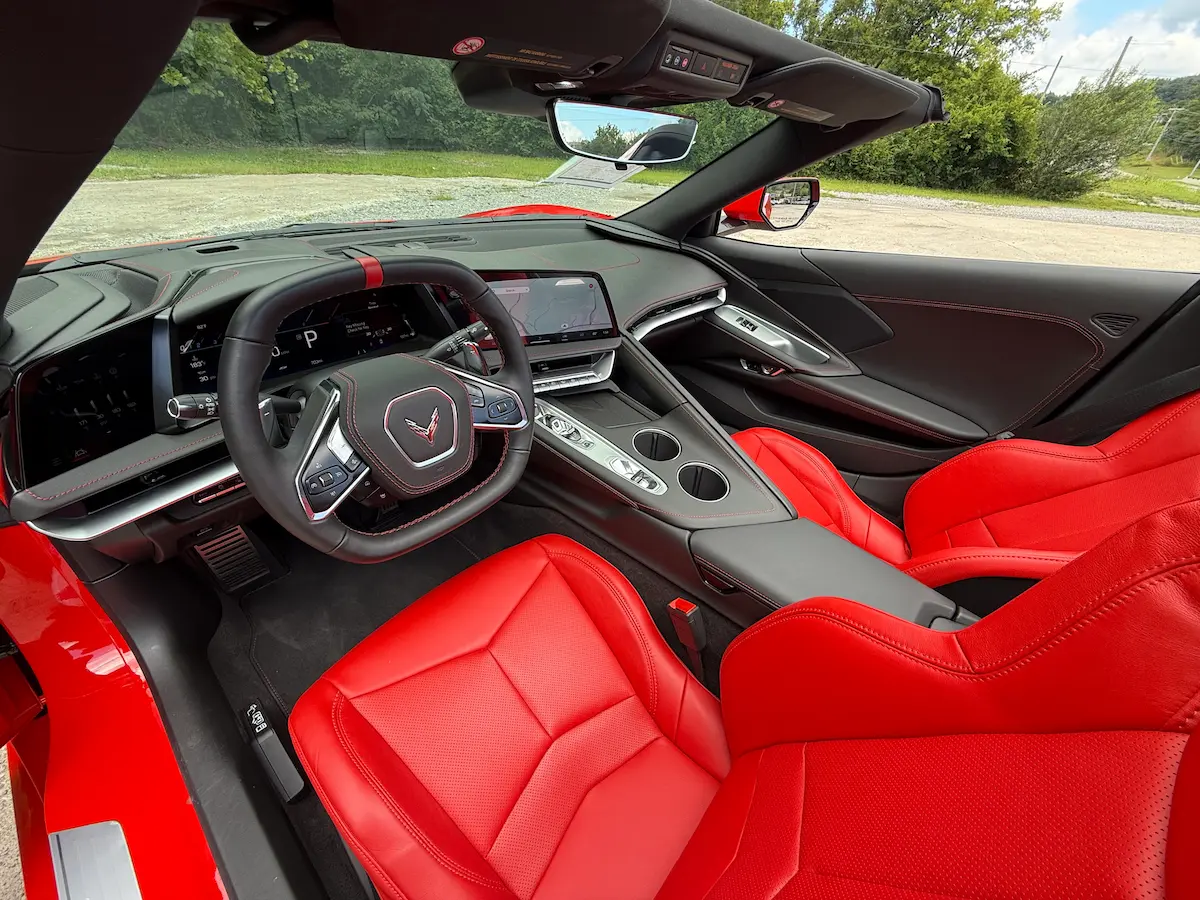 Red leather driver cockpit of a 2026 Chevrolet Corvette Stingray 1LT