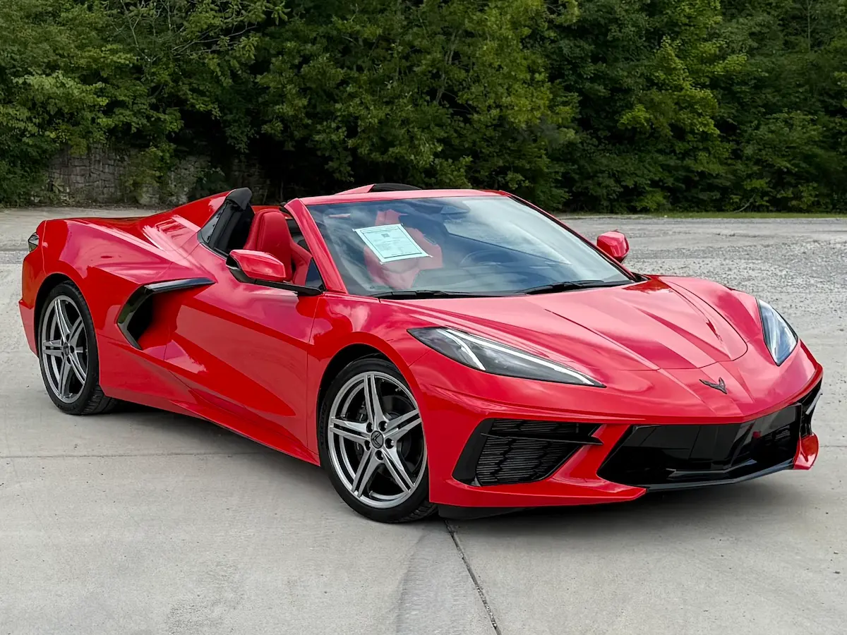 Front three-quarter view of a red 2026 Chevrolet Corvette Stingray 1LT convertible