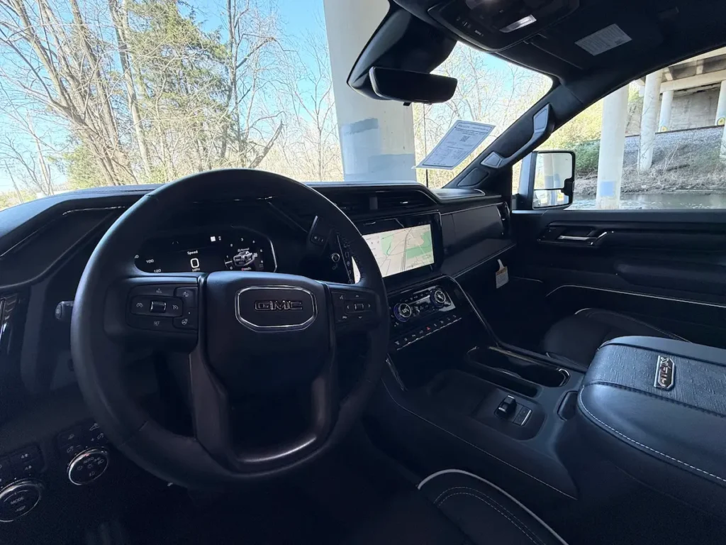 Dashboard and front interior of a black 2026 GMC Sierra 2500HD AT4X