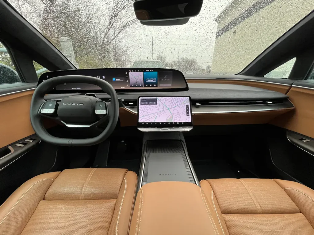 2026 Lucid Gravity interior showing modern luxury EV dashboard, digital screens, and tan seating