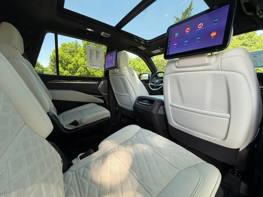 Second-row captain’s chairs and rear entertainment screens in a 2026 Cadillac Escalade