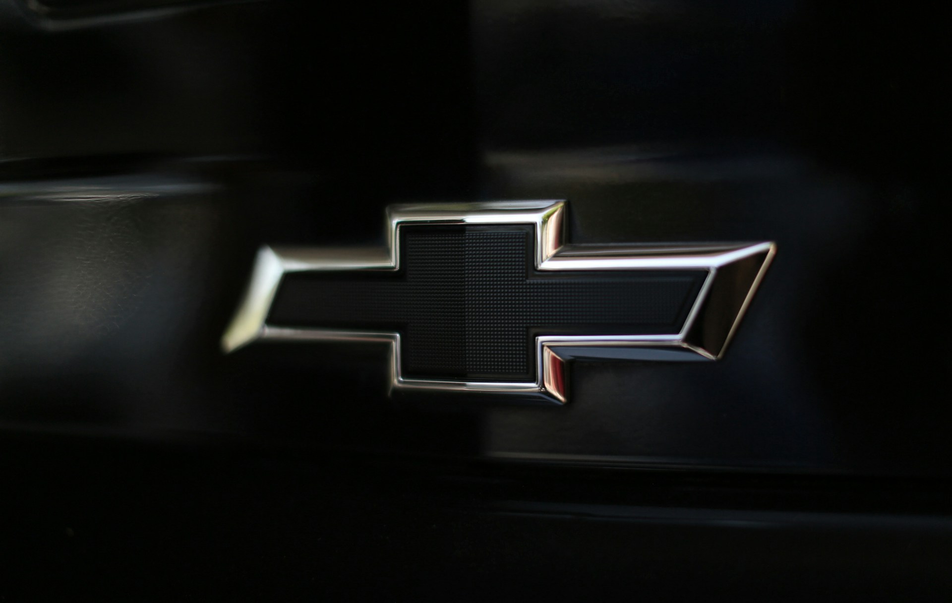 Close-up photo of the Chevrolet logo on a car.