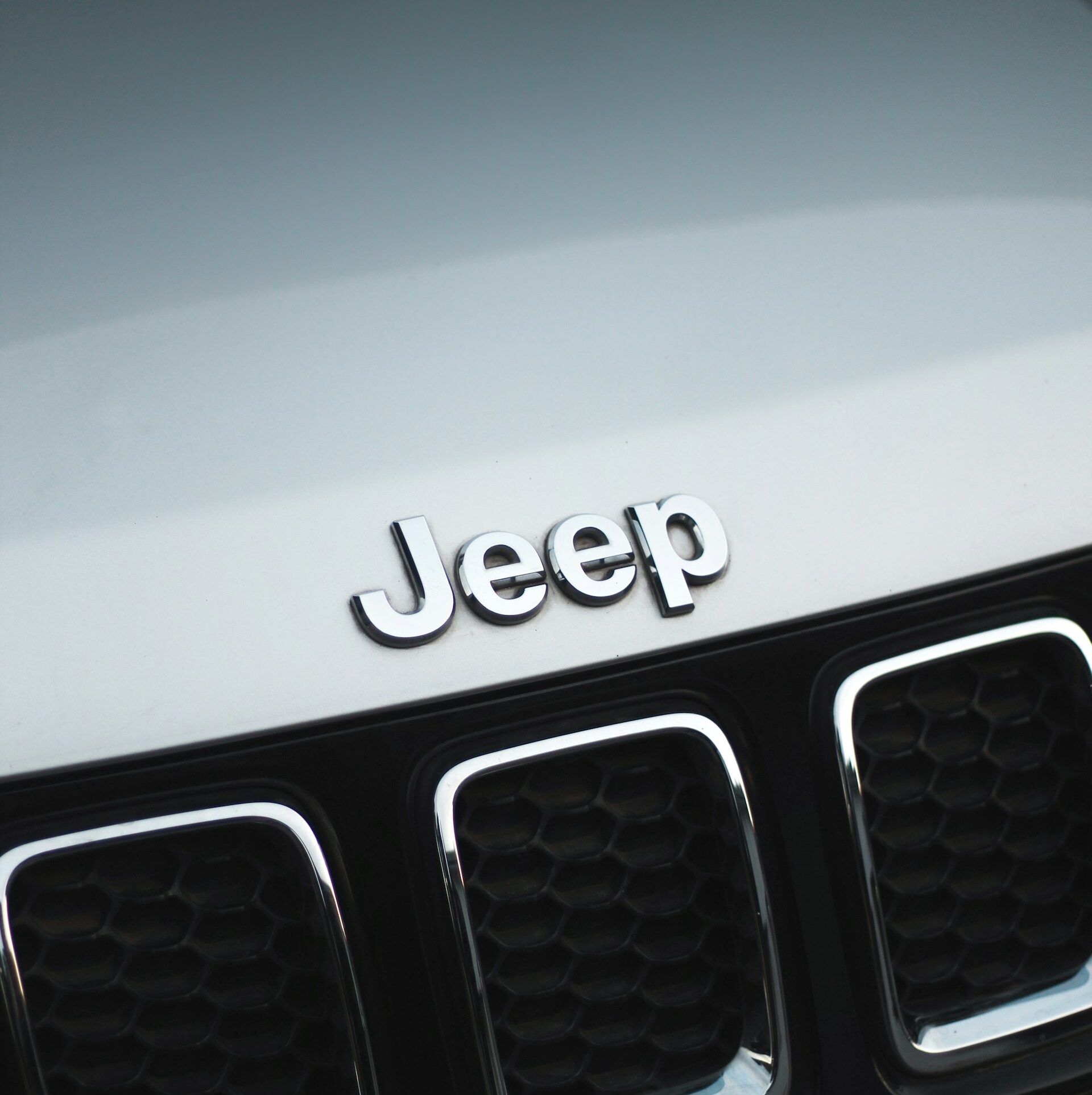 The Jeep logo, featuring a stylized grille with seven vertical slots, sits on a plain background.
