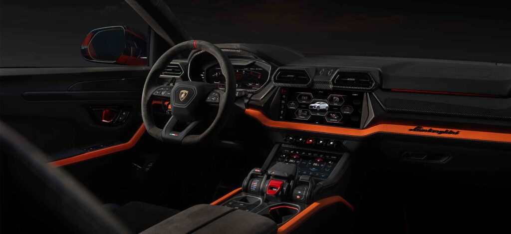 Interior of the 2025 Lamborghini Urus SE, featuring a sleek black and orange design with advanced technology.